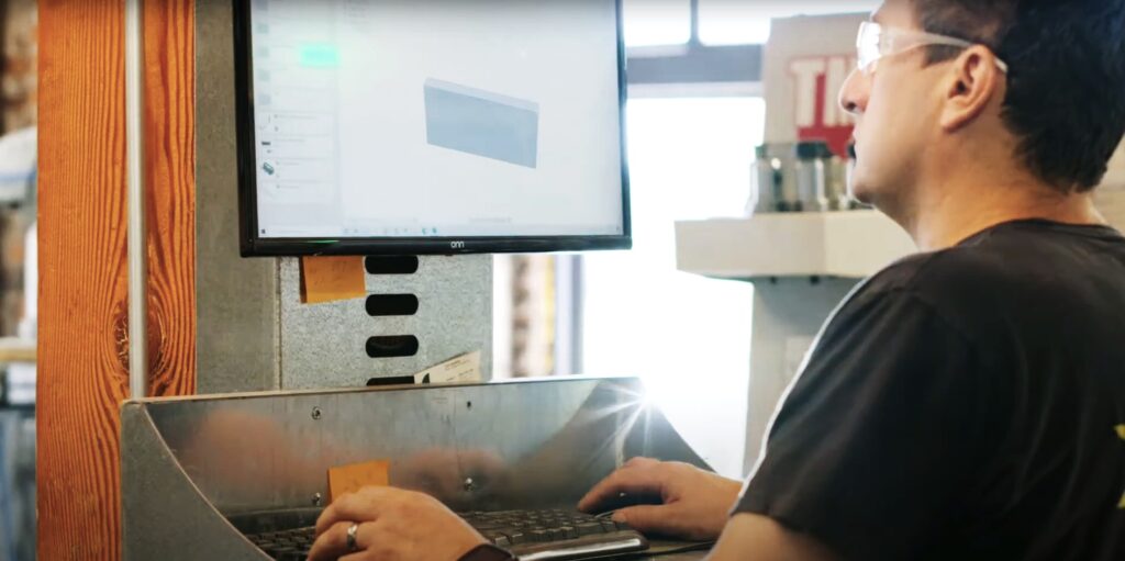 MTC employee using computer software for CNC router design